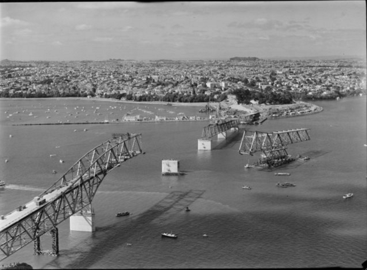 Auckland Harbour Bridge under construction. Whites Aviation Ltd :Photographs. Ref: WA-48833-G. Alexander Turnbull Library, Wellington, New Zealand